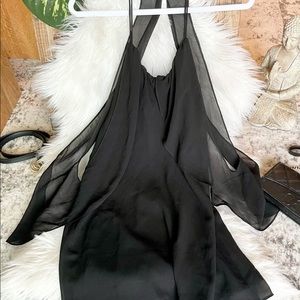 Black, flowing blouse.